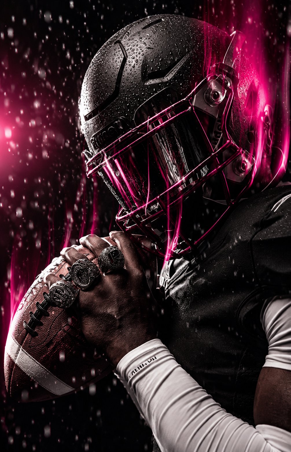 Game Day Creative — football player holding a football with championship rings